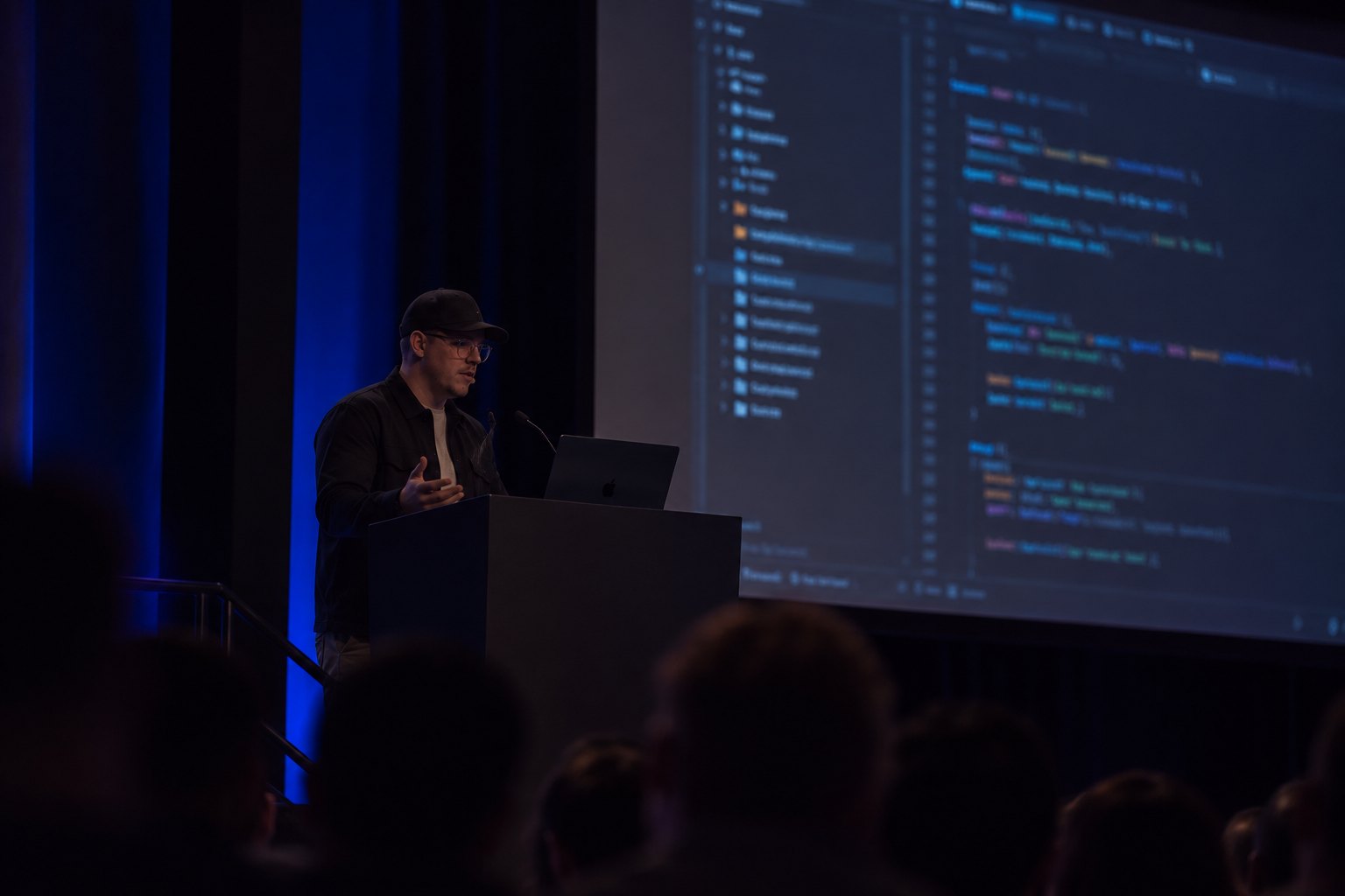 Lawrence Timmins presenting on stage